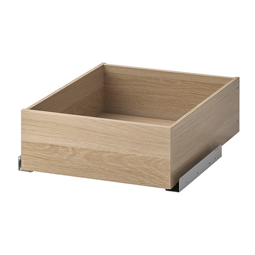 Esta imagen muestra un cajón vacío de madera marrón claro con un diseño minimalista. Forma parte de la serie KOMPLEMENT de ikea, y cuenta con correderas metálicas para un funcionamiento suave.