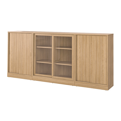 Librería TONSTAD de roble con puertas correderas y de cristal, vetas de madera clara, forma rectangular, diseño moderno.