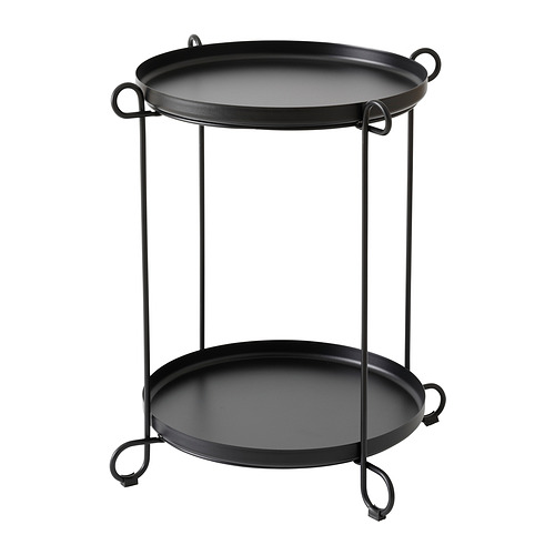 Mesa auxiliar LIVELYCKE negra con dos bandejas redondas, sostenida por una estructura metálica con asas de bucle, perfecta para servir y almacenar.