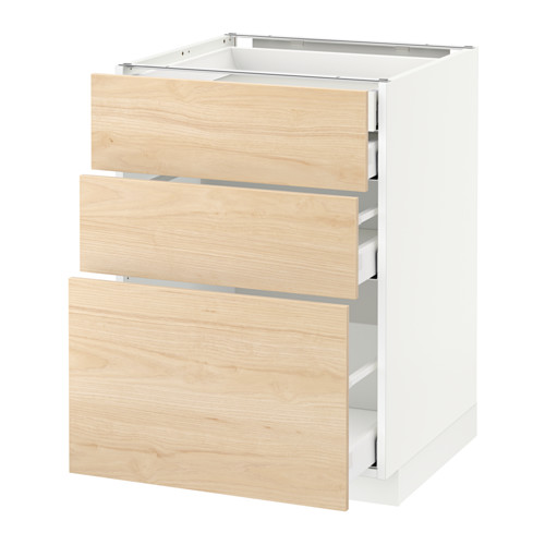 Un mueble de cocina METOD blanco con tres cajones de madera de fresno claro. Es moderno y funcional con cajones de cierre automático.