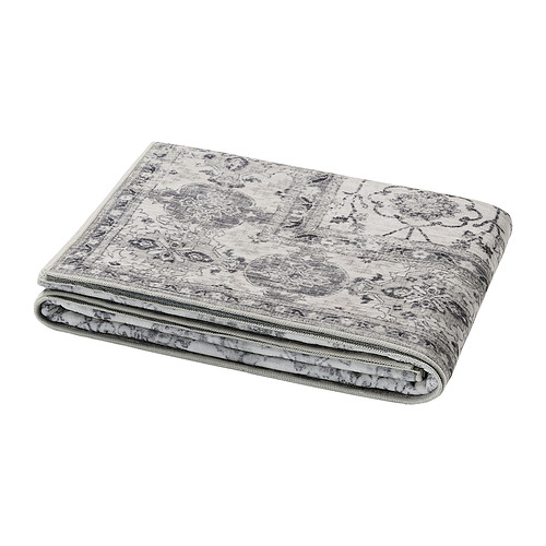 Esterilla de yoga LOKALTÅG gris doblada, poliéster y goma reciclados, diseño intrincado.