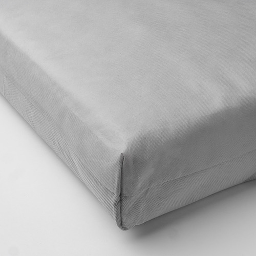 Cojín gris con superficie lisa y uniforme, que muestra su diseño suave y de apoyo.