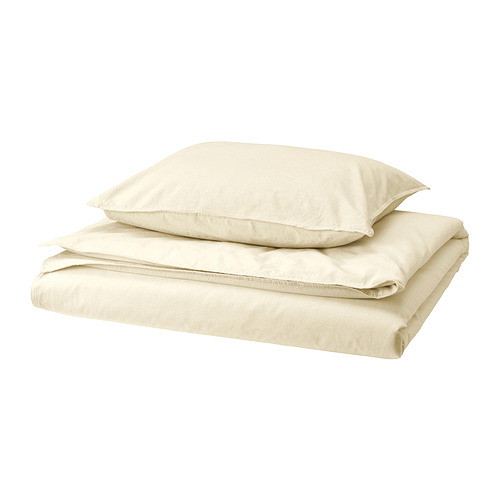 Juego de cama ÄNGSLILJA en color beige natural, con funda nórdica de algodón suave prelavado con cierre inferior y funda de almohada a juego.