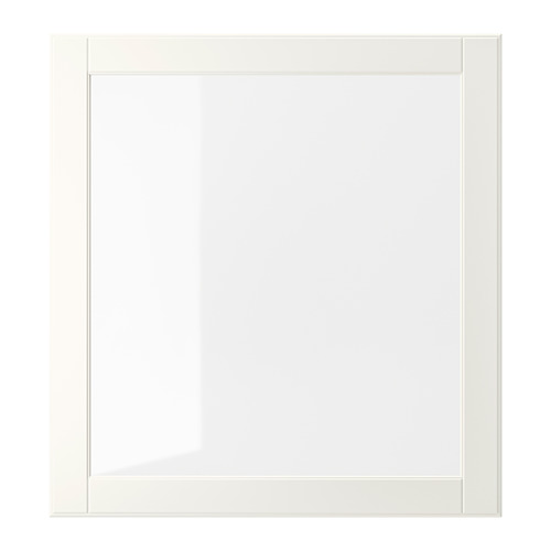 Un armario OSTVIK blanco con puerta de cristal transparente, con detalles tallados para un aspecto tradicional. La puerta se puede montar en ambos lados.