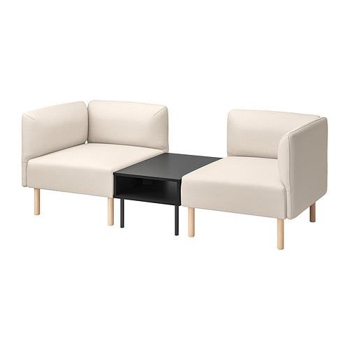 Sofá modular LILLEHEM. Dos secciones acolchadas de color beige claro, una en forma de L y otra sin brazos, unidas por una pequeña mesa negra con patas de madera.