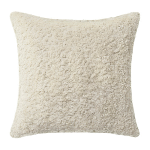 Suave almohada cuadrada de color beige, texturizada como la piel, hecha de poliéster reciclado.