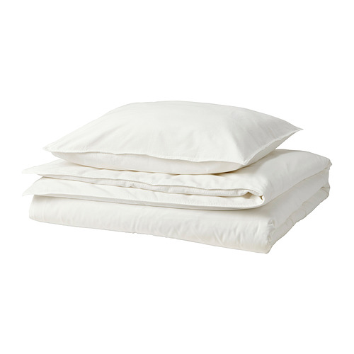 Un juego de fundas nórdicas blancas ÄNGSLILJA, confeccionadas en algodón reciclado, cuidadosamente dobladas, con un aspecto casual y relajado por su acabado lavado.