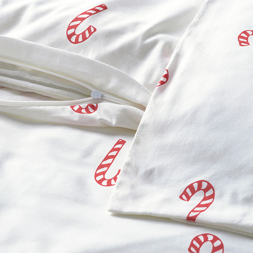 Sábana blanca con estampado de bastón de caramelo rojo; Cierre de cremallera en funda de almohada.