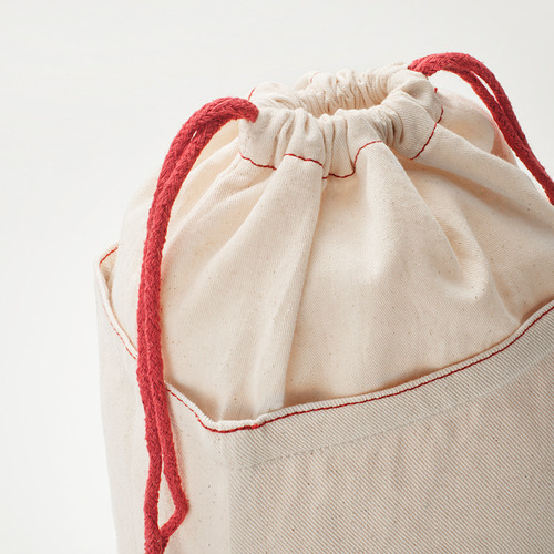 Una bolsa de almacenamiento de algodón de alta calidad con cordones rojos, costuras cuidadosamente cerradas y detalladas.