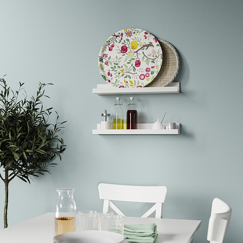 Bandeja redonda de pared con motivos florales, útil para servir y decorar.