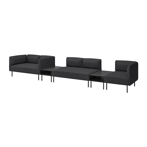 Moderno conjunto de sofás modulares negros de tres cuerpos, patas metálicas y diseño minimalista.