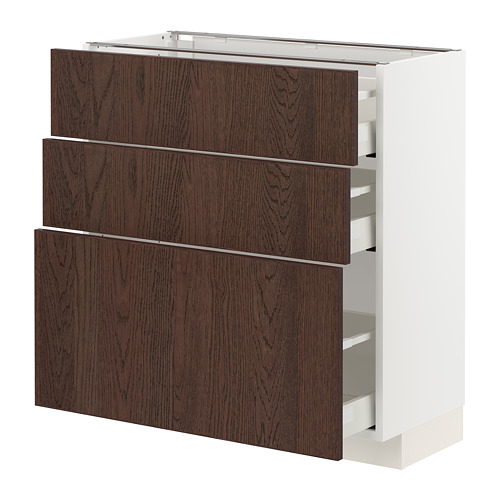 Un mueble de cocina METOD blanco con tres cajones de madera marrón oscuro.