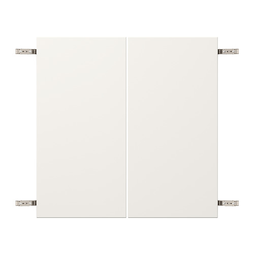 Detalle de bisagra de armario VEDDINGE blanco, acero niquelado y tableros de fibra.