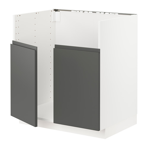 Exhibe un moderno mueble de cocina IKEA METOD blanco de estilo minimalista, con puertas en gris oscuro con tiradores integrados.