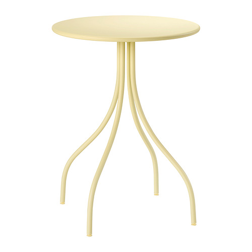Una mesa auxiliar TÅNEBRO, amarilla, con tapa redonda y patas curvas.