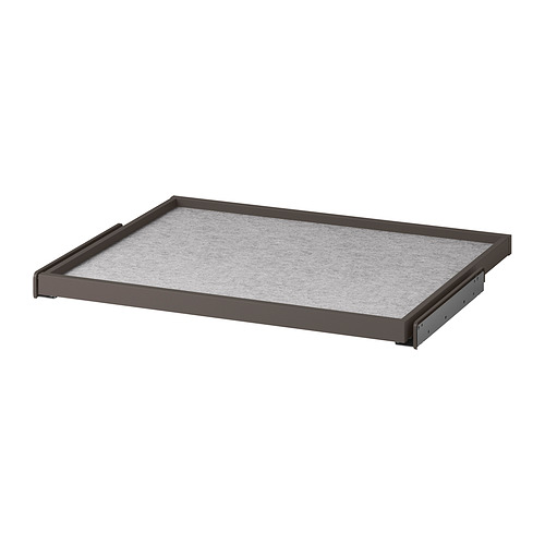 Una bandeja extraíble gris de KOMPLEMENT para el almacenamiento, rodeada por un marco marrón con un suave forro de fieltro de puntos de silicona.