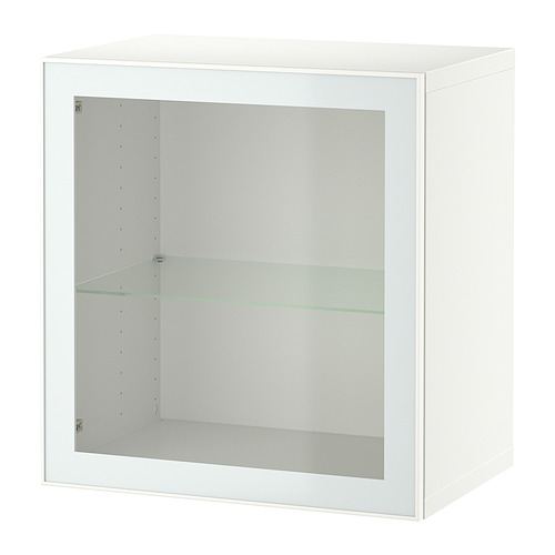 Un armario blanco BESTÅ con puerta de cristal transparente que muestra el espacio de almacenamiento en el interior.