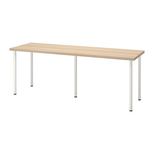 Una mesa rectangular de color madera clara sobre cuatro patas de metal blanco. Es moderno, minimalista y perfecto para espacios pequeños.