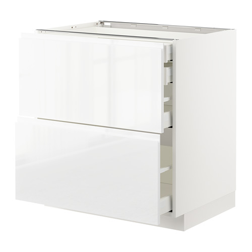 Juego de armarios de cocina blancos de alto brillo con tiradores y cajones integrados.