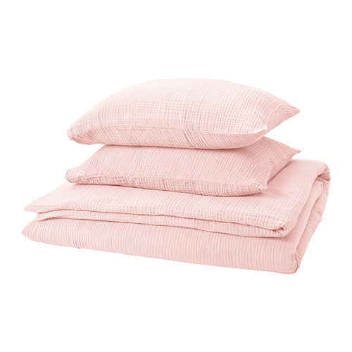 Una pila de ropa de cama de color rosa claro con textura ondulada, con una funda nórdica y dos fundas de almohada. Confeccionado en algodón 100% orgánico.