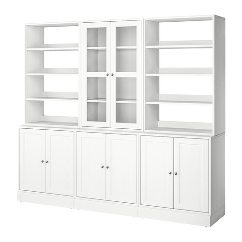 Librería blanca HAVSTA: cuatro secciones, puertas de cristal, pino macizo, diseño clásico.