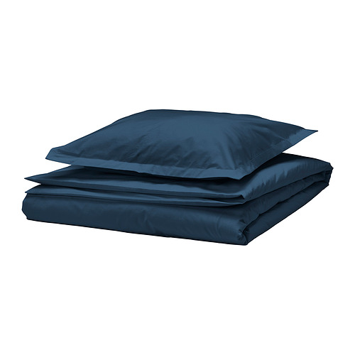 Juego de cama azul oscuro. Incluye fundas planas y de almohada. Hecho de algodón crujiente.
