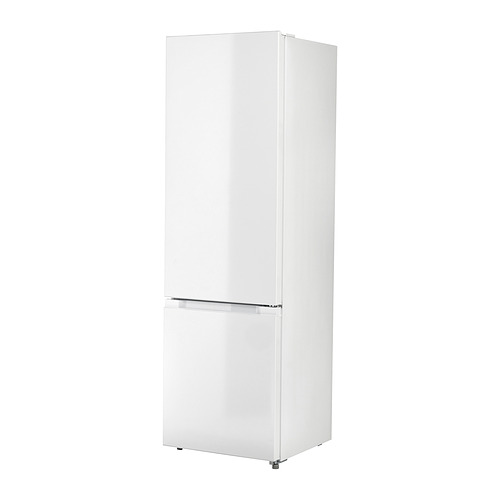Frigorífico-congelador vertical blanco con diseño sin costuras y cajón transparente en la parte inferior.