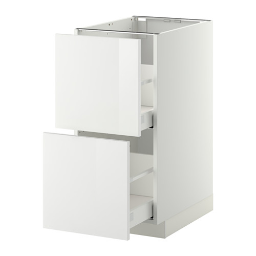 Mueble de cocina blanco de alto brillo con cajones abiertos, diseño moderno y elegante.