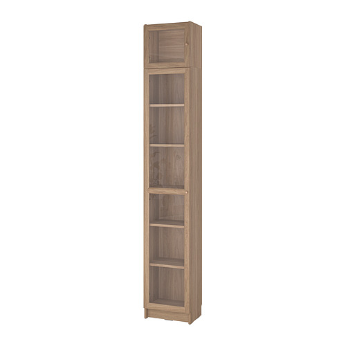 Estantería alta de madera BILLY con puertas de vidrio, acabado marrón claro, cinco estantes, diseño elegante.