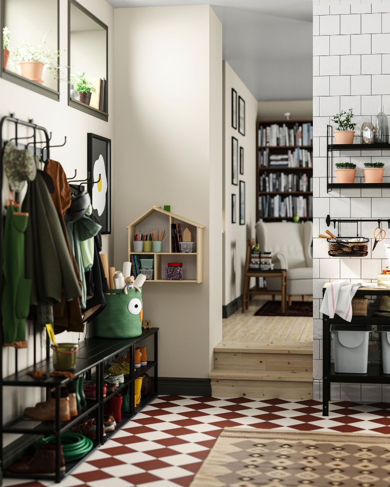 Hallway with a coat rack, and wall decor, leading to a cozy living space.