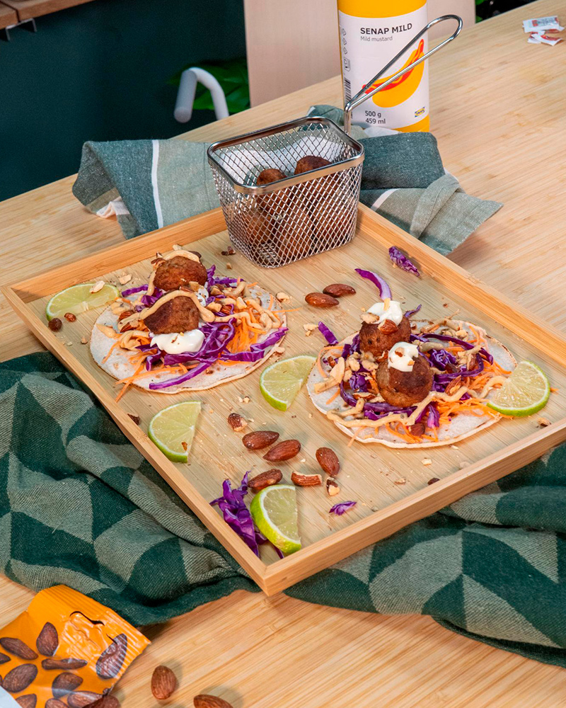 IKEA vegetable meatballs on a skillet and a wooden board.
