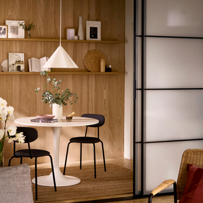 dining room and living room separated by a room divider