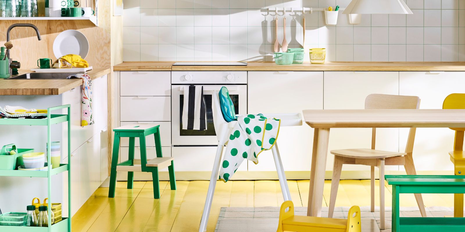 Scandinavian modern kitchen with white ANTILOP highchair, NISSAFORS trolley and LISABO table and chair