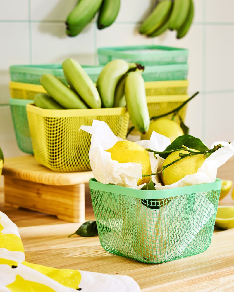 Lemons and bananas stored in green and yellow mesh IKEA 365+food storage baskets.