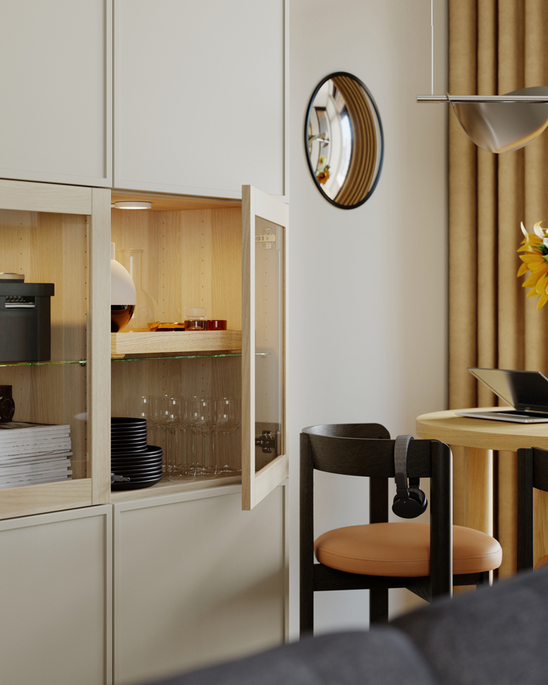 FJÄDERHARV mini chests with 2 drawers and other things inside a BESTÅ storage combination with doors with one door open.