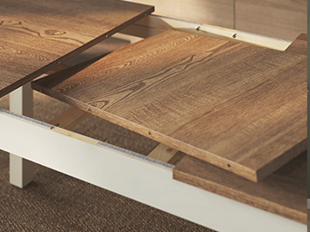 Detail of an extendable table with wood grain top and white frame.