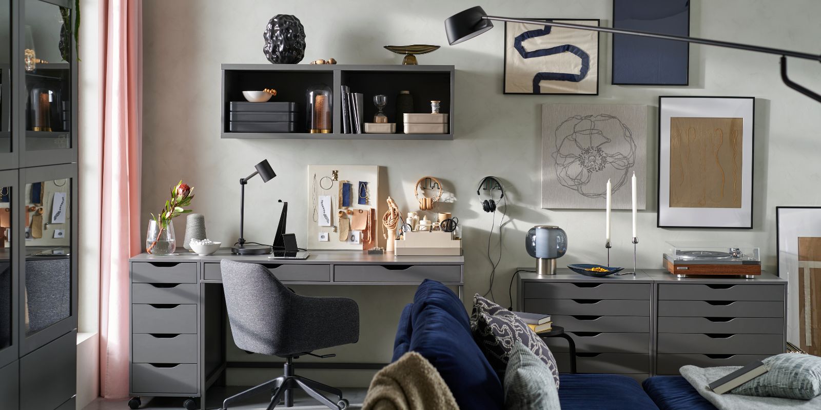 Home office with desk, comfortable chair and storage space