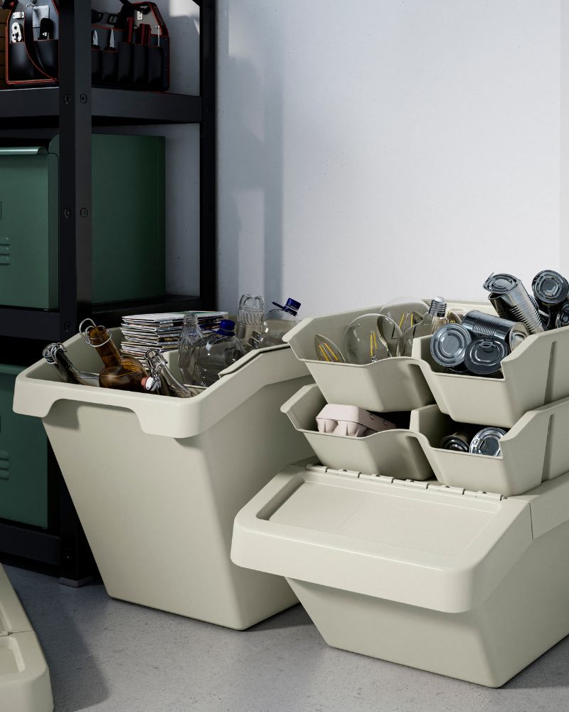 Organized recycling area with SORTERA bins and compartments, offering a practical system for sorting glass and metal.