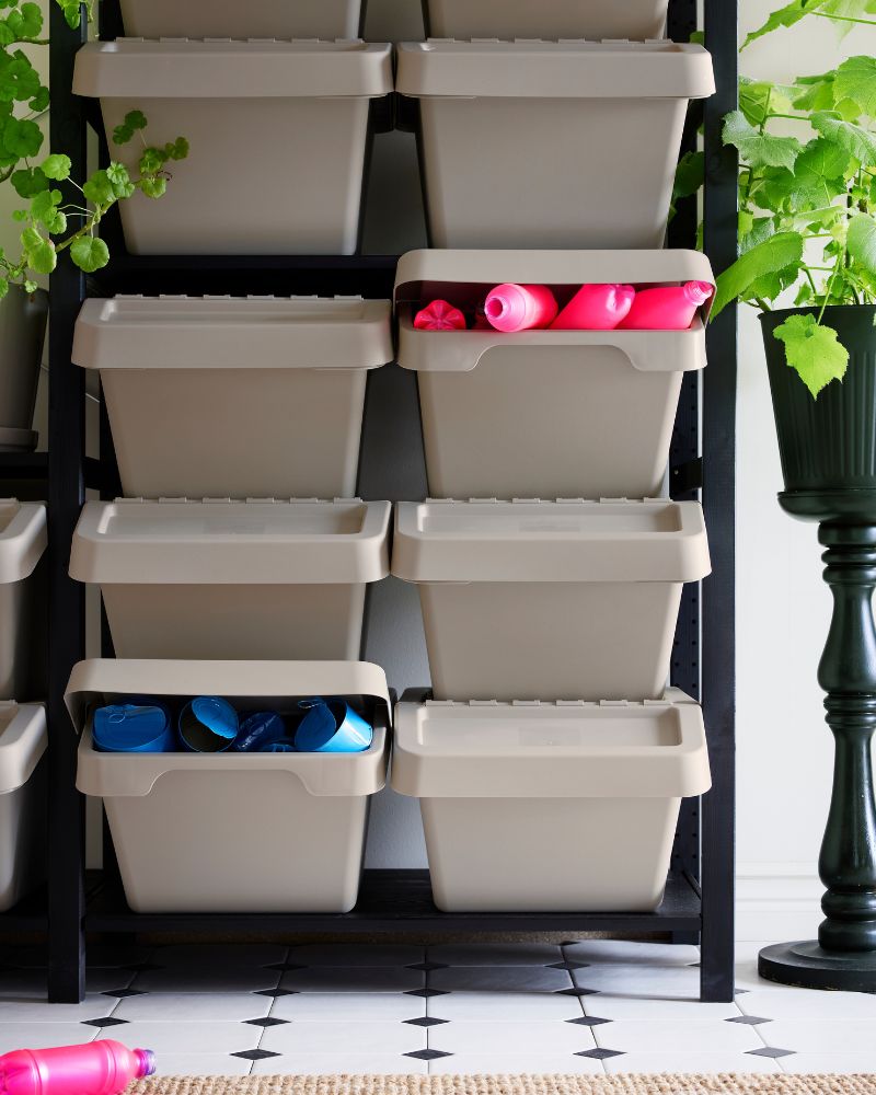 BROR shelving with SORTERA bins creates a practical setup for organizing toys and accessories in a bright space.