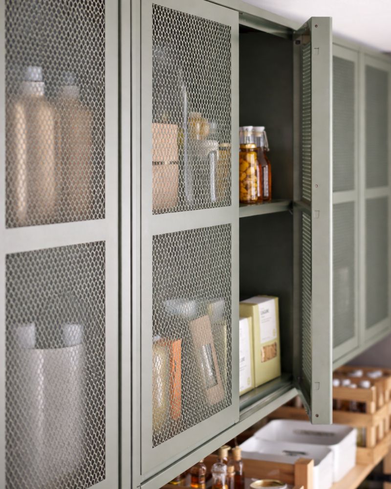 IVAR cabinet with KORKEN bottles creating a neat, practical storage space for jars and pantry items.