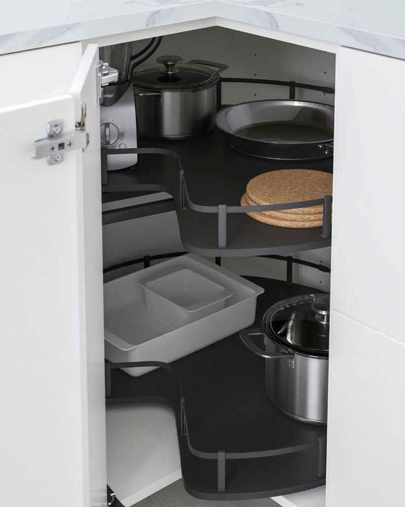 Smart corner kitchen cabinet with IKEA SEKTION base unit, UTRUSTA rotating shelves and KASKER rail for organized cookware storage.