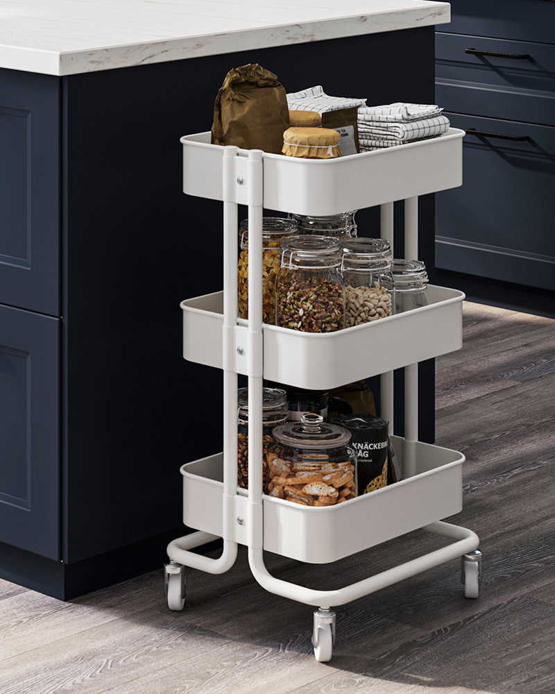 A white RÅSKOG kitchen trolley and several KORKEN glass jars with lids.