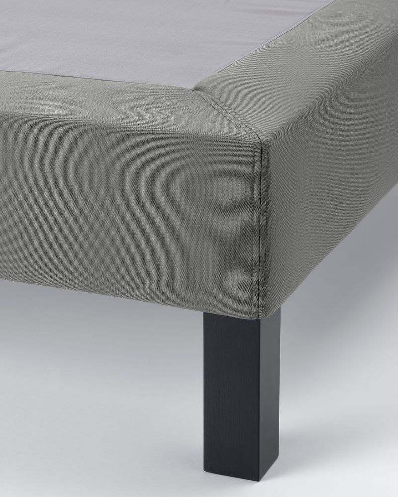 Contemporary bedroom with LYNGÖR bed base with slats and legs, featuring a sleek upholstered frame and sturdy support.